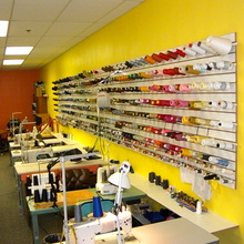 Sewing machines and colorful thread inside the Matos shop